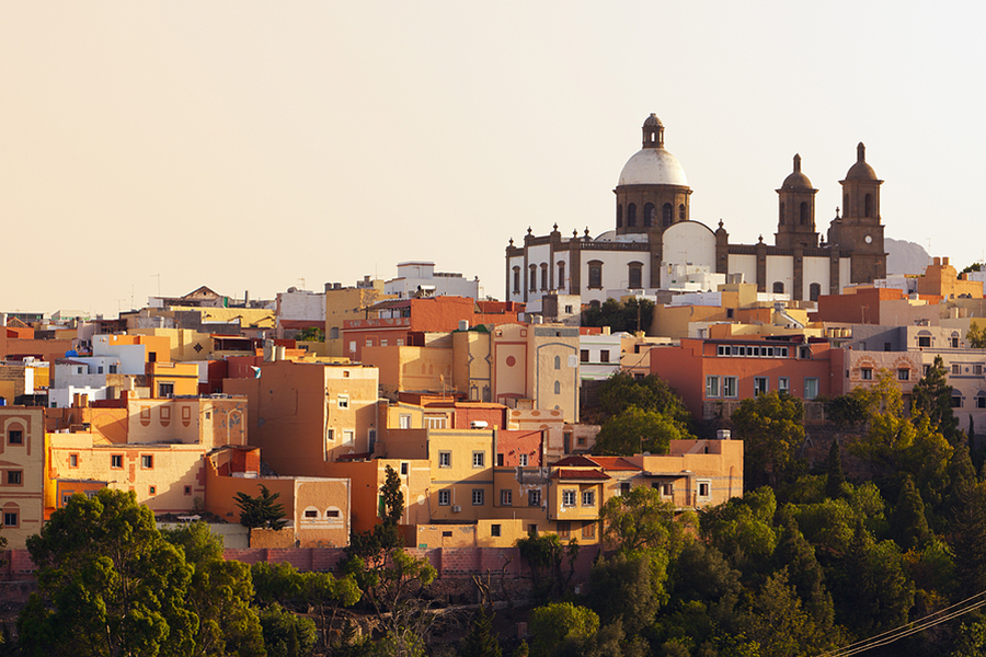 The church of San Sebastian above the village of Aguimes, Grand The church of San Sebastian above the village of Aguimes, Grand Canary, in evening light